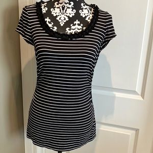 WHBM black and white t-shirt with rounded neckline enhanced with double ruffle.